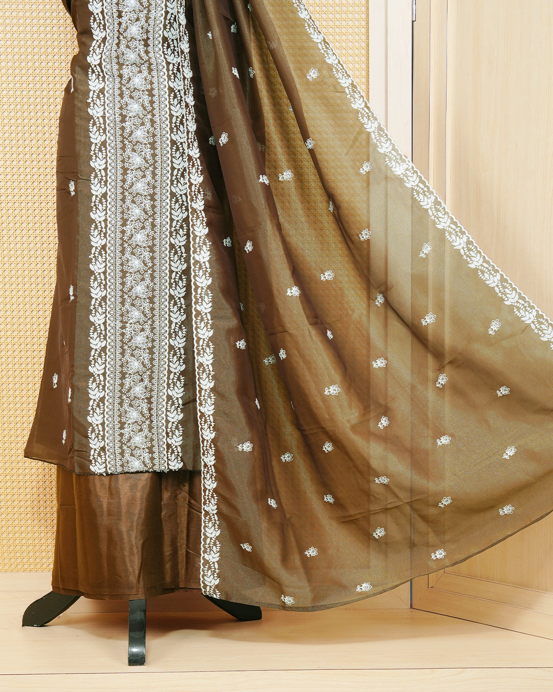 Brown Georgette Salwar Material Features an Inrcate Floral Emproidary Pattern Aborned With Shimmering Sequin Accents, paired with matching bottom & elegant Duptta
