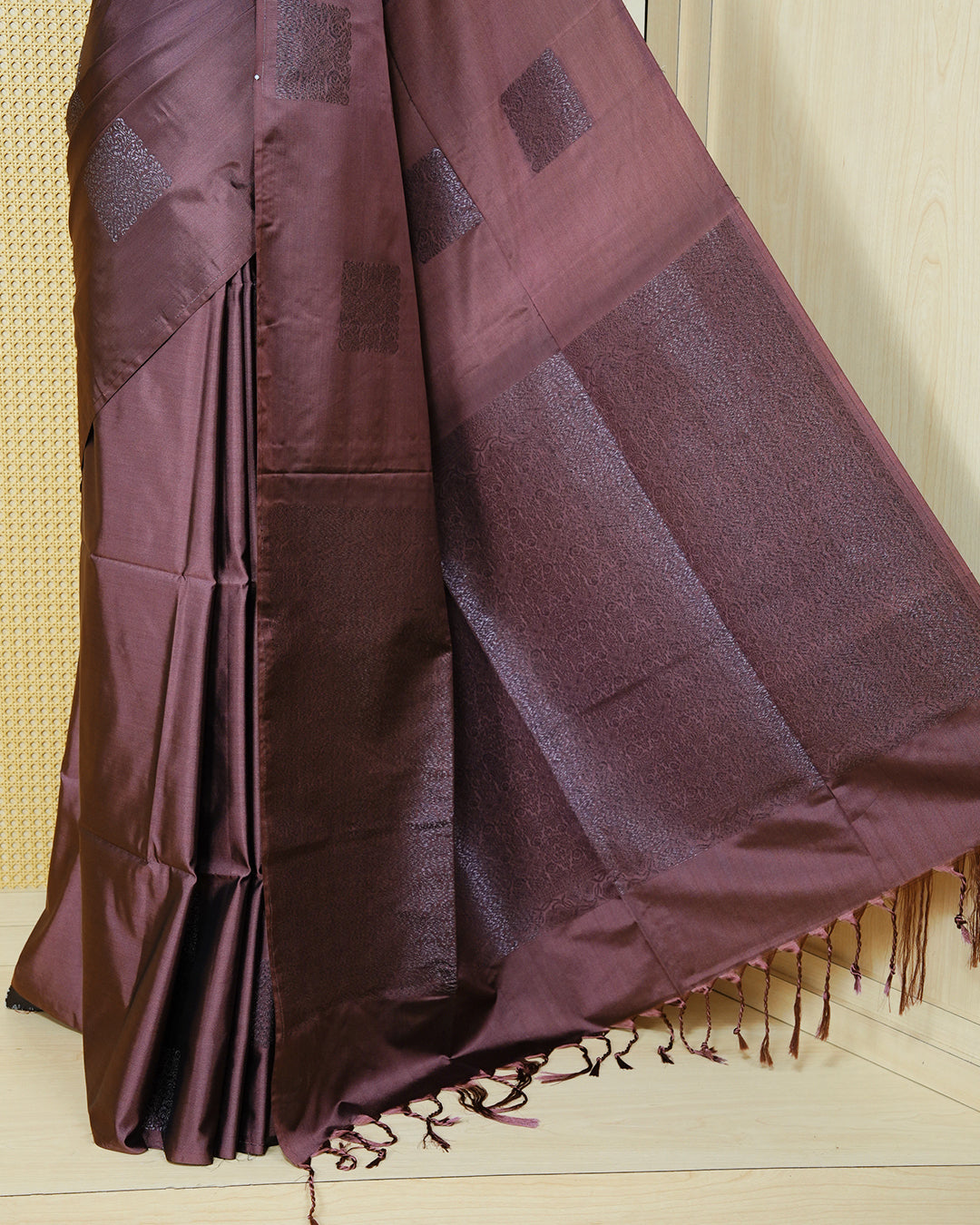 Dark mauve colour soft silk saree featuring antique zari motifs on body with contrast self colour pallu & paired with matching blouse piece.
