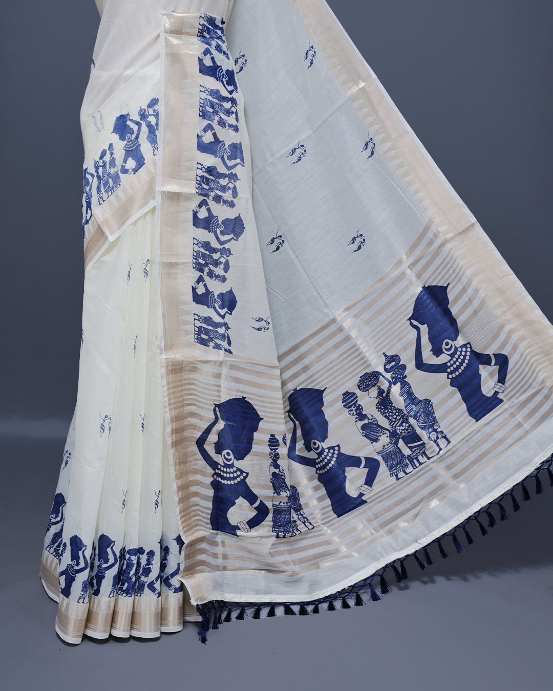 Cream colour Semi chanderi kerala saree featuring Blue colour Print on body, complemented by Light Gold zari Border, paired with matching blouse piece.