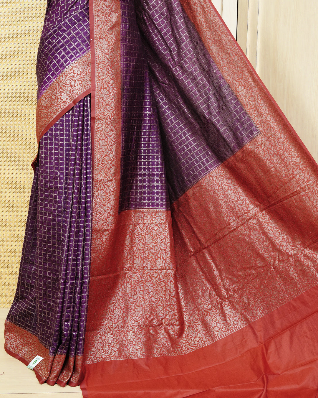 Vibrant purple Colour Semi georgette Saree having zari dotted check pattern on body, contrast Brick orange colour floral kodi designed Border, Rich Pallu comes with Matching Blouse piece.