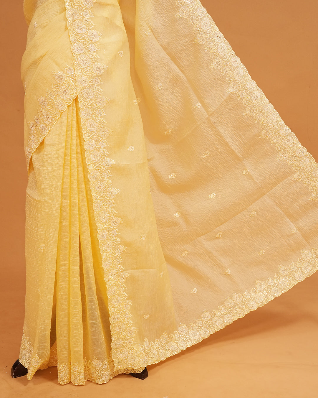 Pastel Yellow colour Crush organza saree with Cut Beats & Sequins.