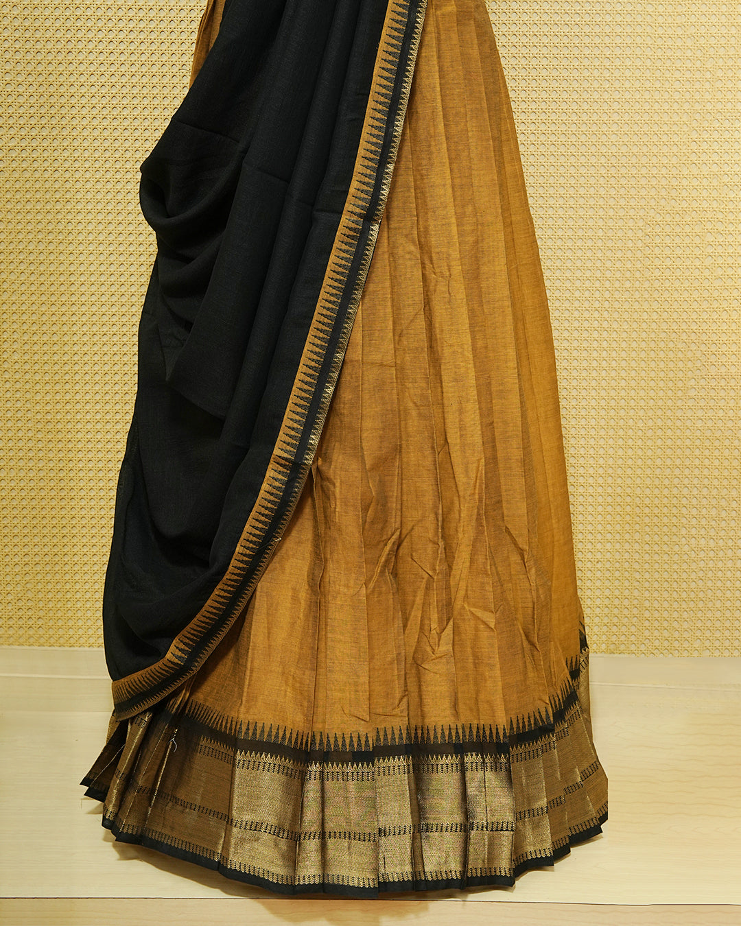 Mustard Colour chettinad cotton Semi stitched dhavani set featuring Contrast Black with Gold zari border skirt, comes with Matching blouse piece & dupatta.