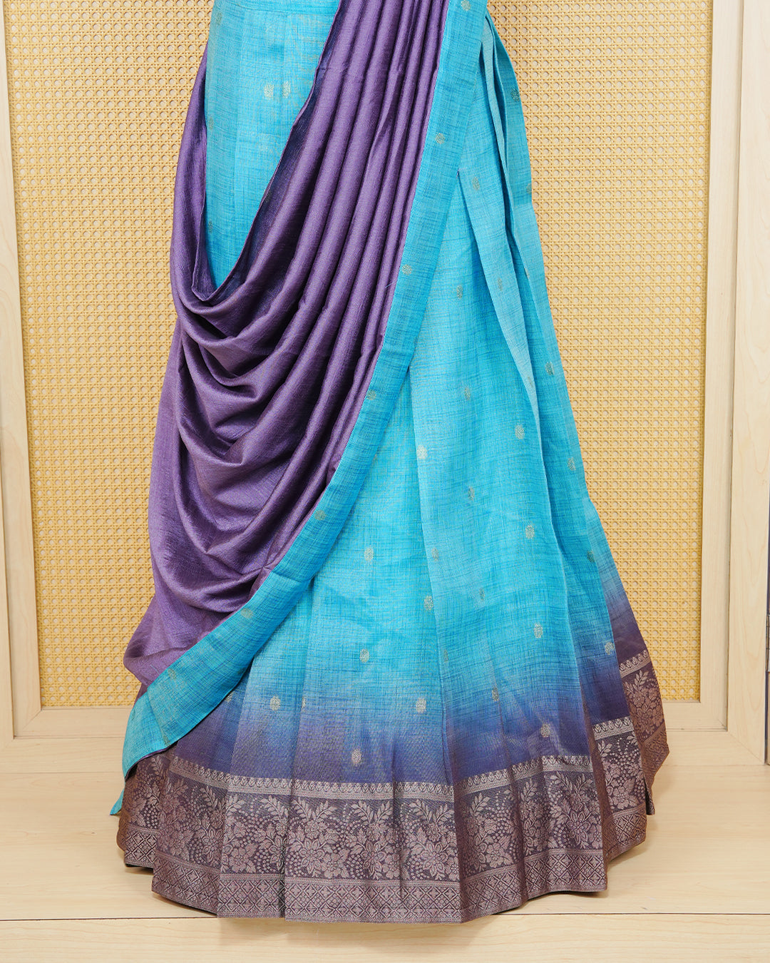 Sky blue & lavender colour Linen Silk Semi stitched dhavani set featuring buttas, zari bordered skirt & blouse piece and dupatta.