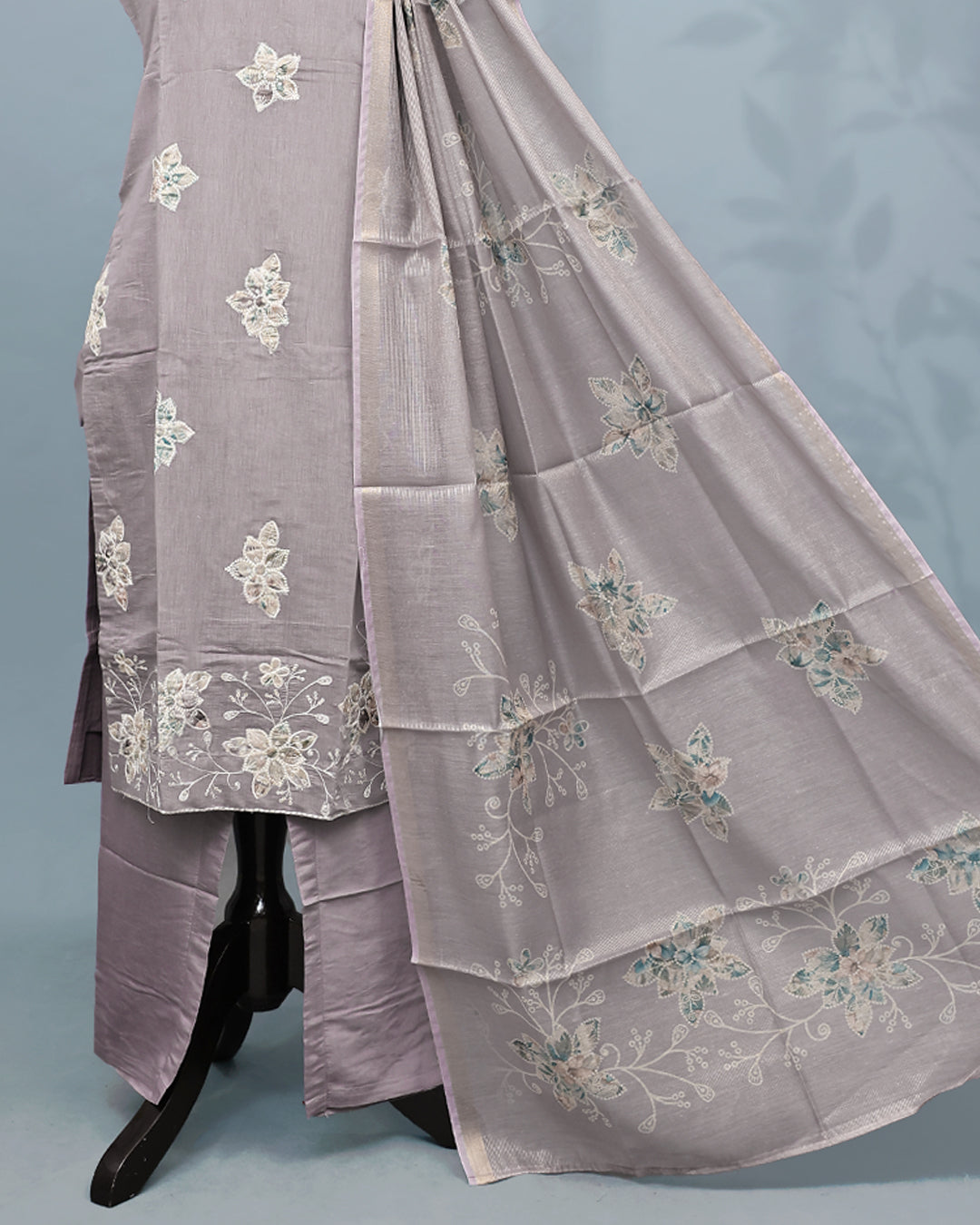 Lavender colour Salwar set comes top with floral pattern on body, paired with matching bottom and dupatta.