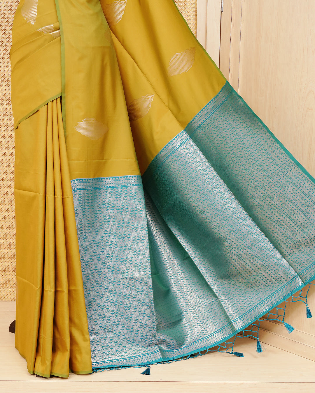 Mehandi colour semi silk saree.
