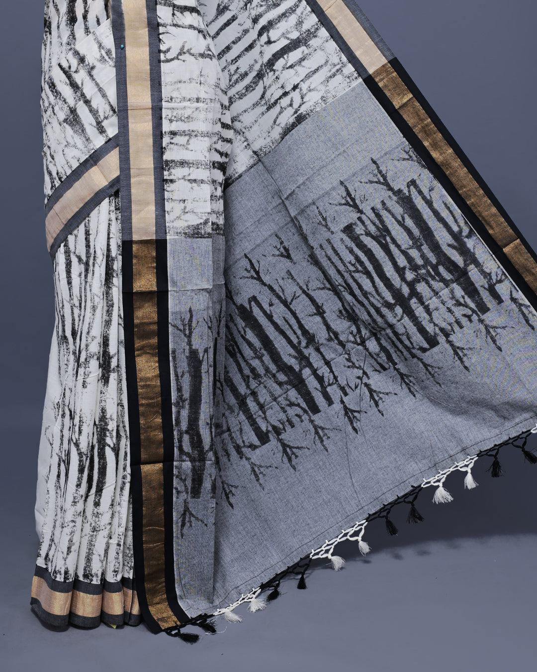 Cream colour Semi chanderi kerala saree featuring Black colour Print on body, complemented by Light Gold zari & black Border, paired with matching blouse piece.