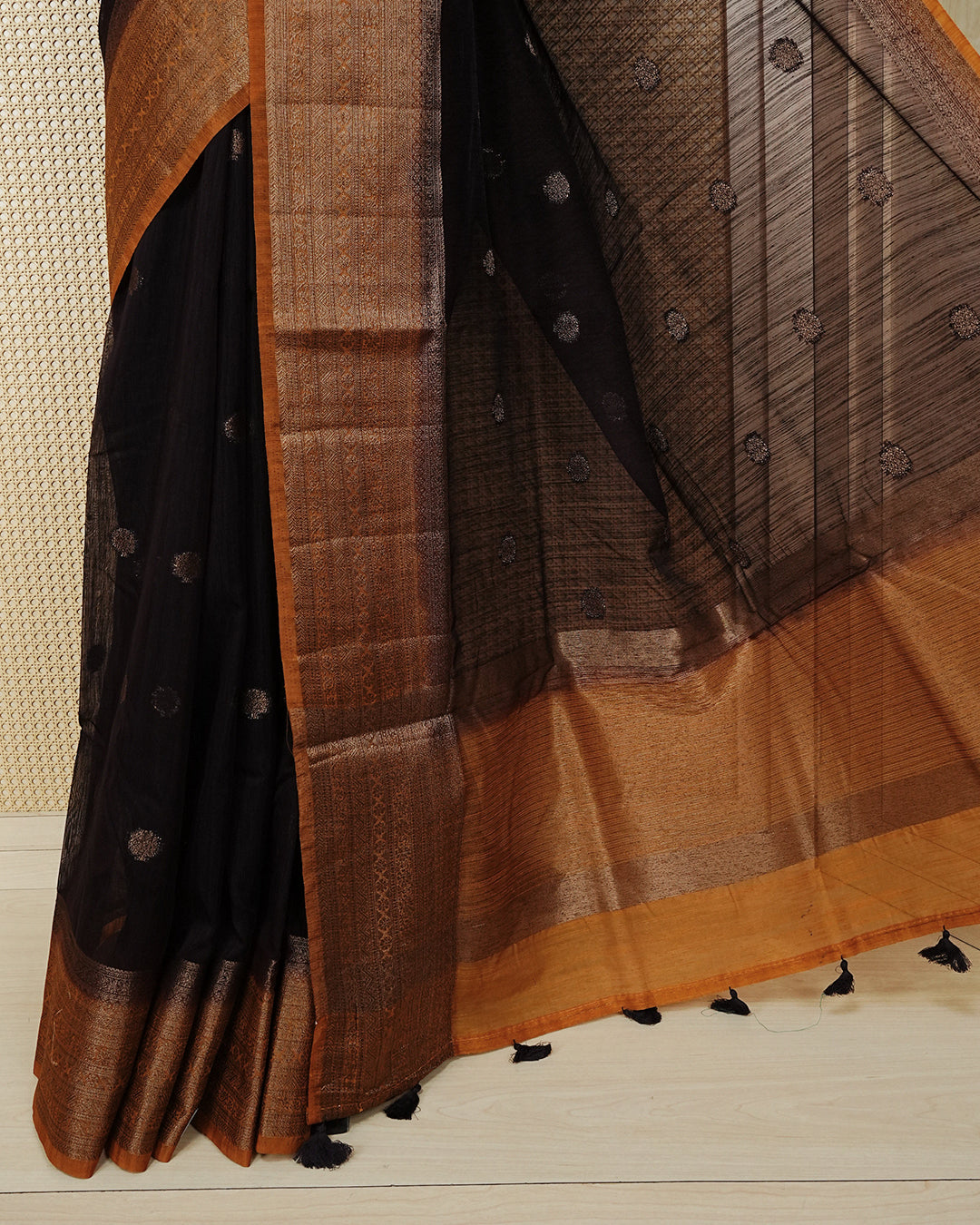Dark brown colour semi linen saree thread motifs on body, contrast mustard orange colour gold zari border, rich pallu comes with matching blouse piece