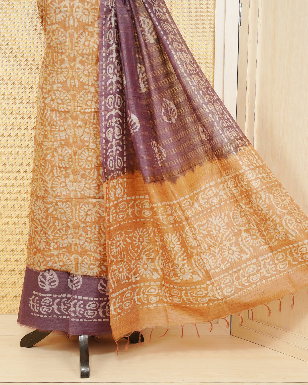 Brown Cotten Silk Salwar Mateirial Features an Elegant Floral Batik Print Pattern Aborned With Fine Weaved Zari highlights, Paired with matching bottom & elegant Dupatta