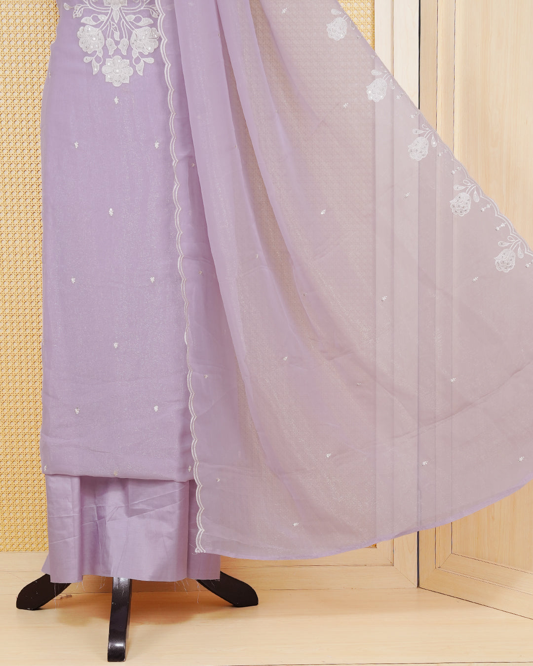 Lavender Pink Georgette Salwar Material featuring an intricate floral embroidery pattern adorned with shimmering sequin accents, paired with a matching bottom and an elegant dupatta.