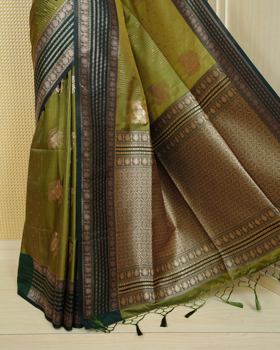 Olive & gold double shade Mulberry silk saree featuring gold floral zari patterns on body , paired with contrast forest green colour with traditional border, comes with matching blouse piece.
