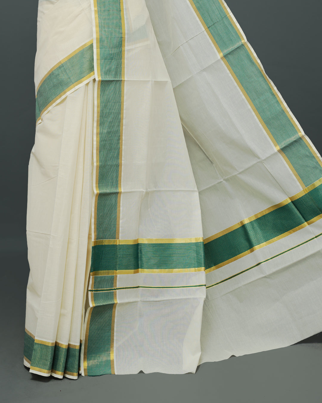 Cream colour Kerala saree Featuring an Elegant plain body, complemented by a classic gold & Green zari border, matching blouse piece.