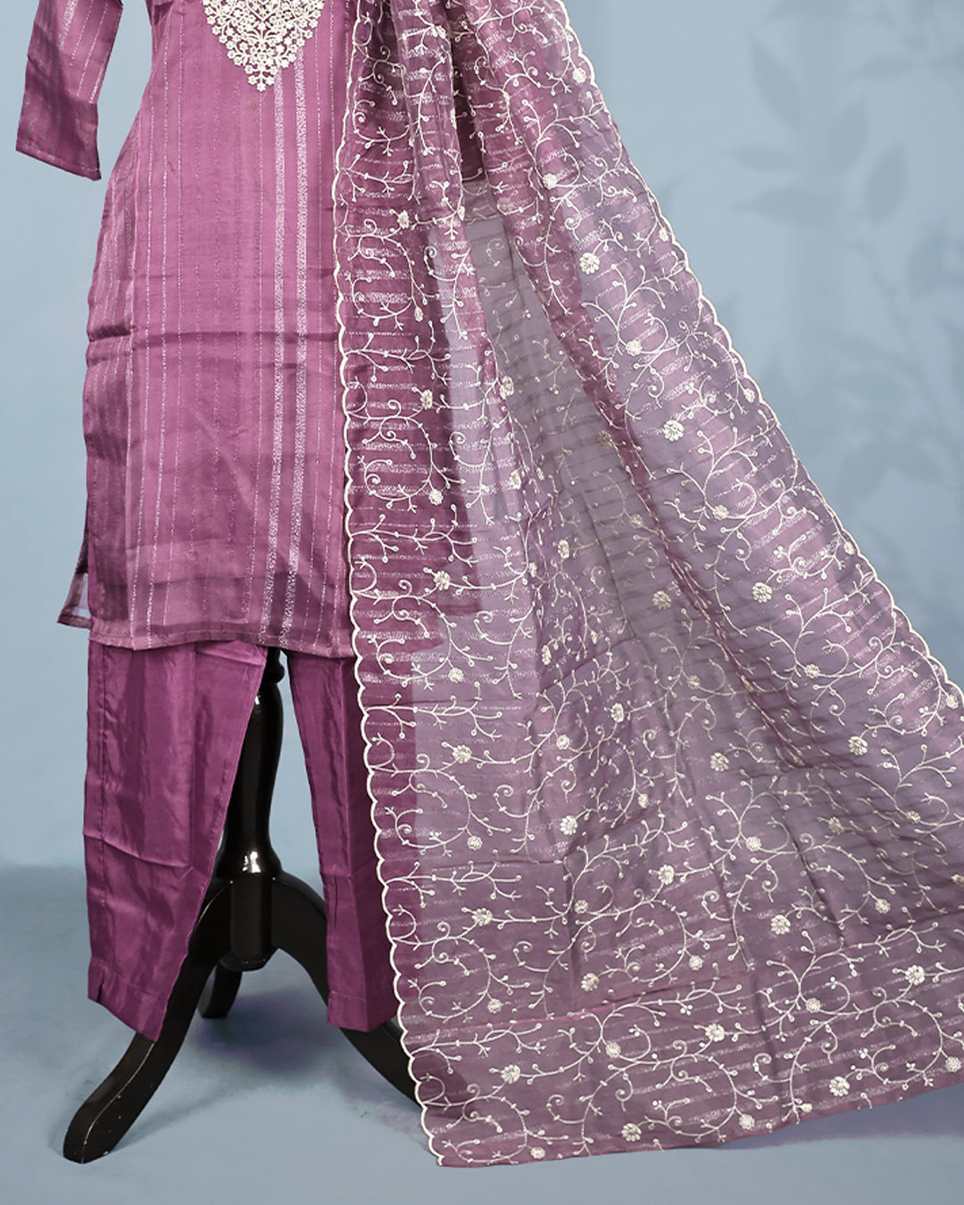 Purple colour salwar set with Sequins & thread work on top, paired with matching bottom & Dupatta.