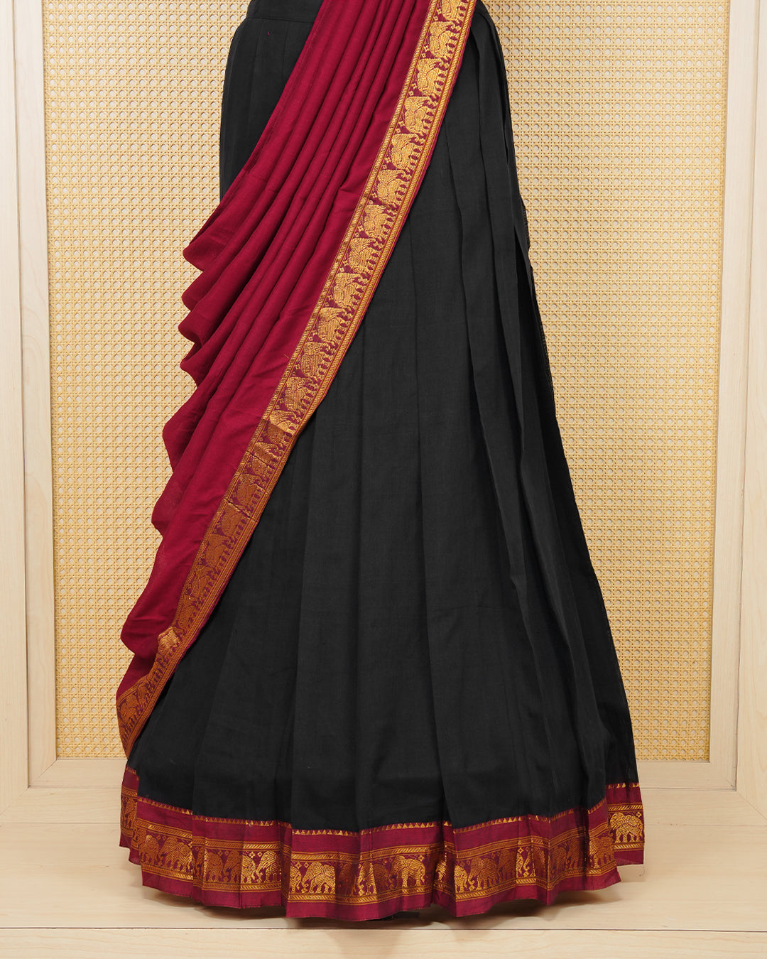 Black colour Chettinad Semi Stitched dhavani set Featuring maroon with light Gold zari work on skirt, matching Blouse & Contrast dupatta.