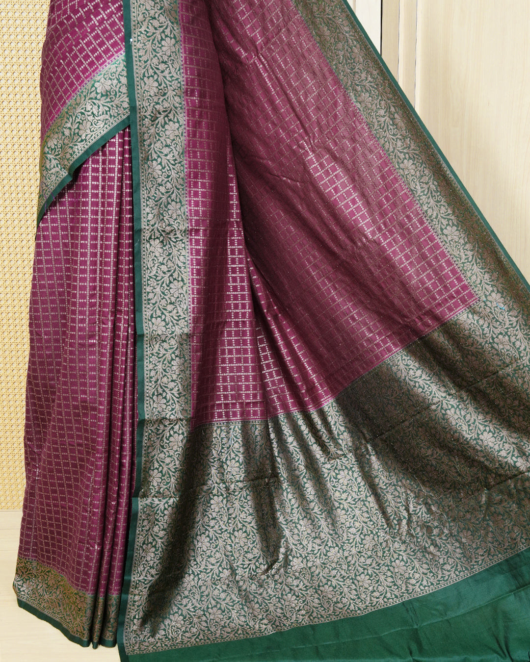 Royal purple Colour Semi georgette Saree having zari dotted check pattern on body, contrast dark forest green colour floral kodi designed Border, Rich Pallu comes with Matching Blouse piece.