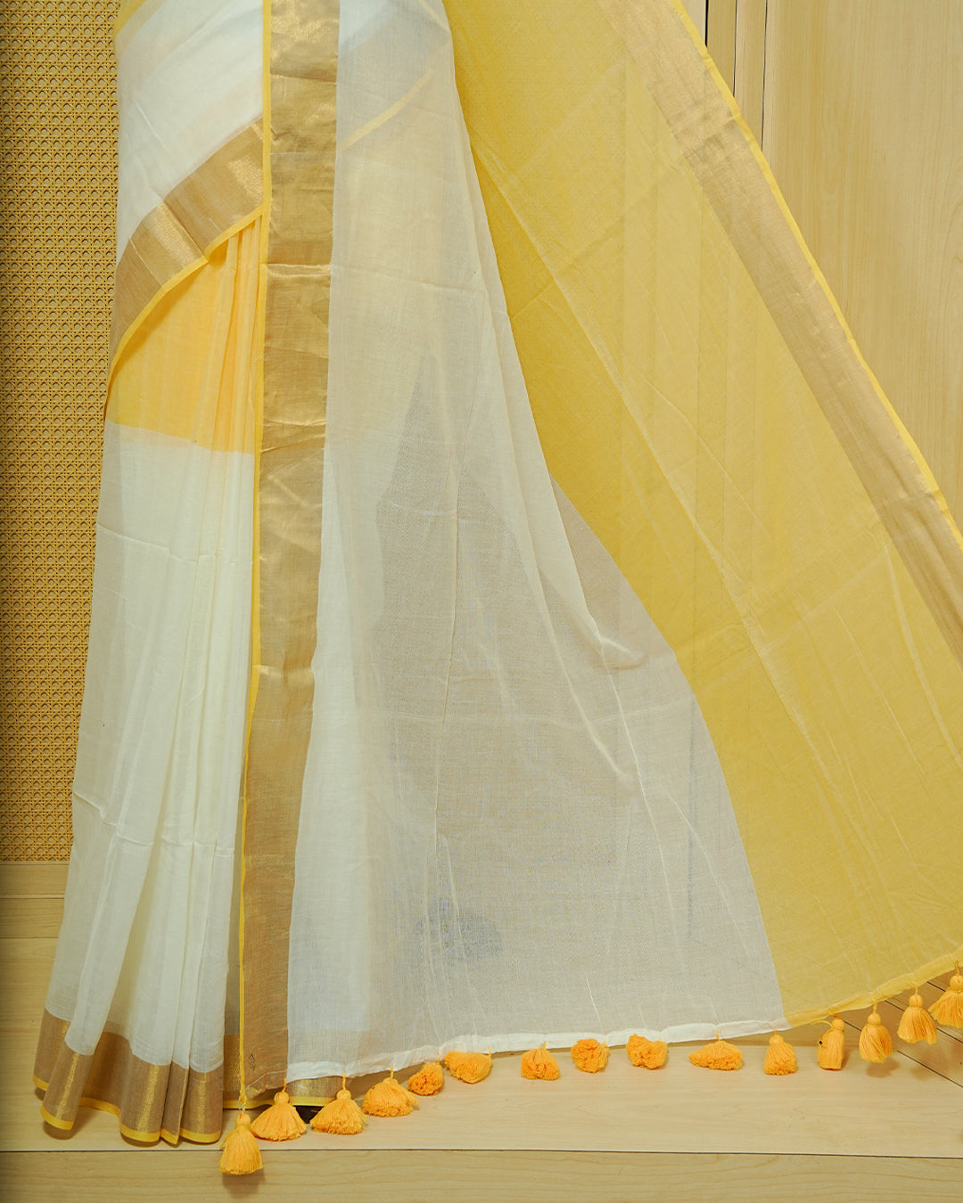Yellow & White Colour Half & Half Mul cotton saree Complemented by contrast Green colour Border & tassels.