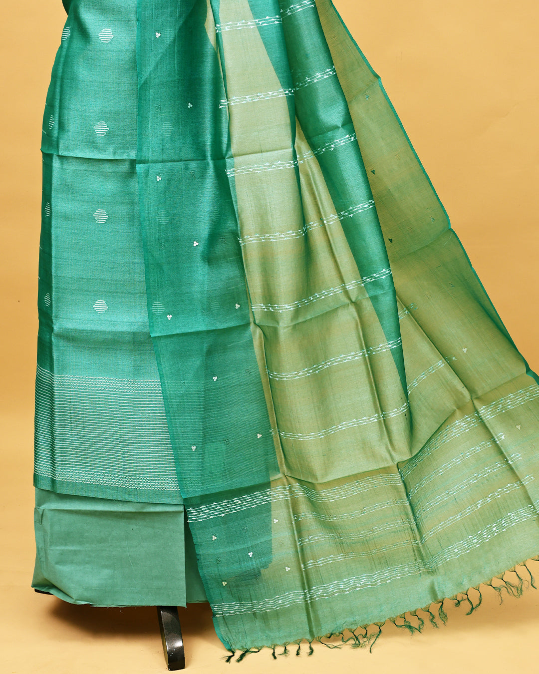 Pastel green colour Tissue Salwar material with thread work on body, matching bottom & Dupatta.