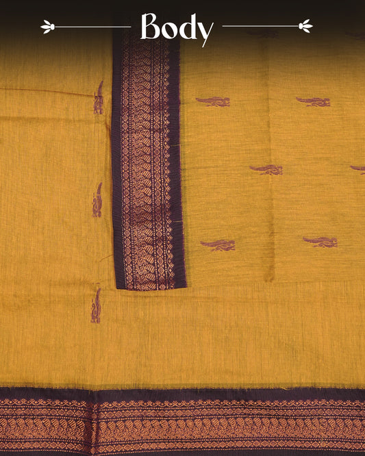 Mustard Yelow colour kalyani cotton saree featuring Grape Colour Peacock pattern on body, complemented by Grape with Grand Copper Zari border, paired with matching blouse piece