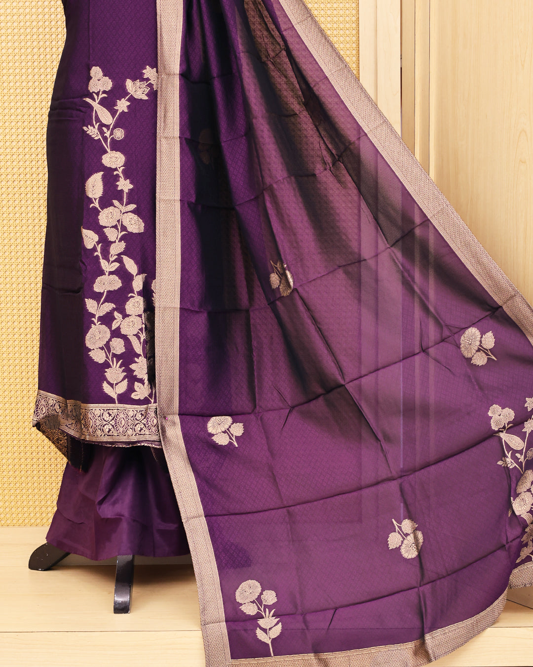 Purple colour Banaras salwar material featuring Zari floral work on body, paired with Matching bottom & dupatta.