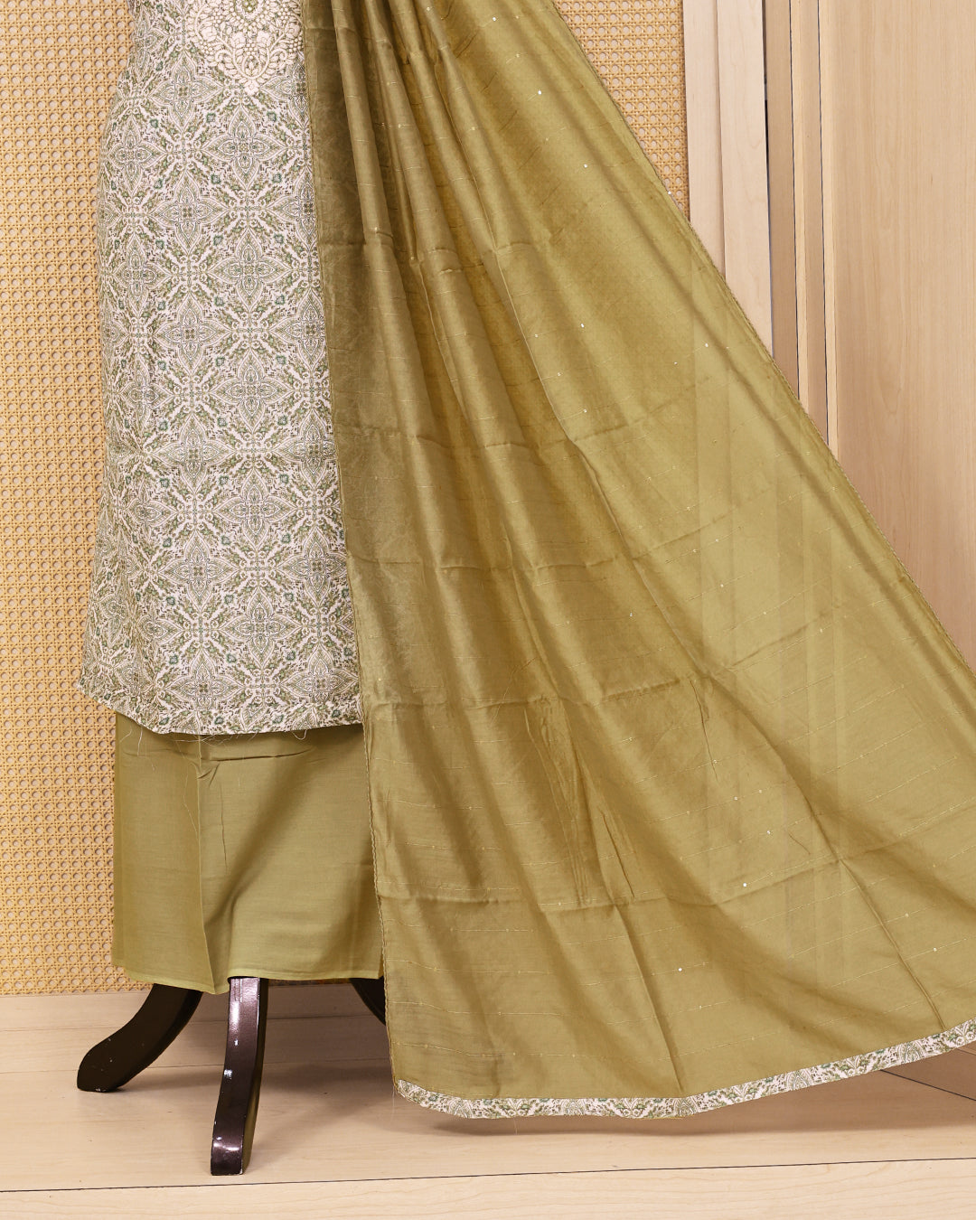 Ivory & Sage Green colour linen Salwar Material featuring intricate ethnic motifs with delicate embroidered detailing on the neckline, paired with a matching solid bottom and a graceful sage green dupatta