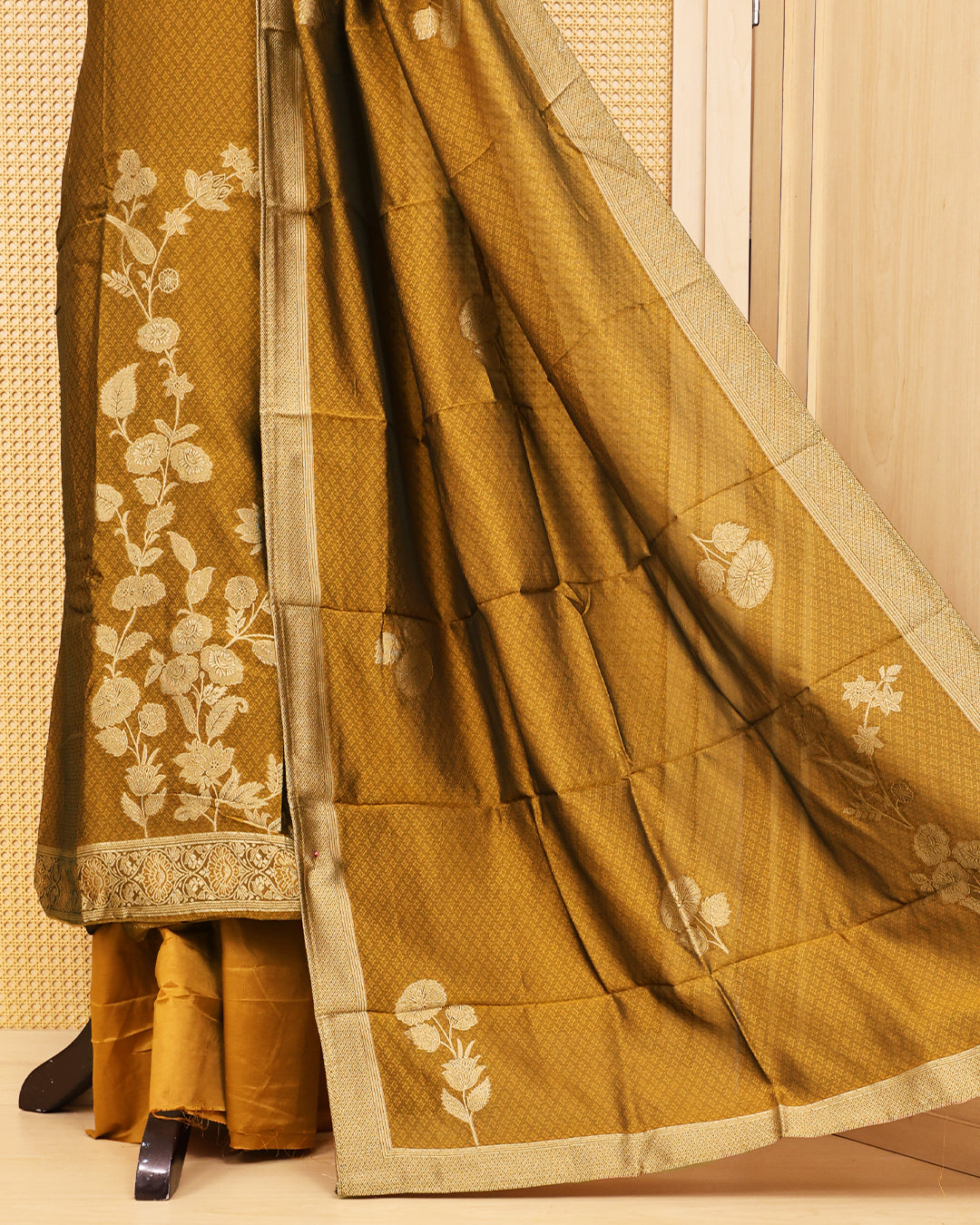 Golden Olive colour Banaras salwar material featuring Zari floral work on body, paired with Matching bottom & dupatta.