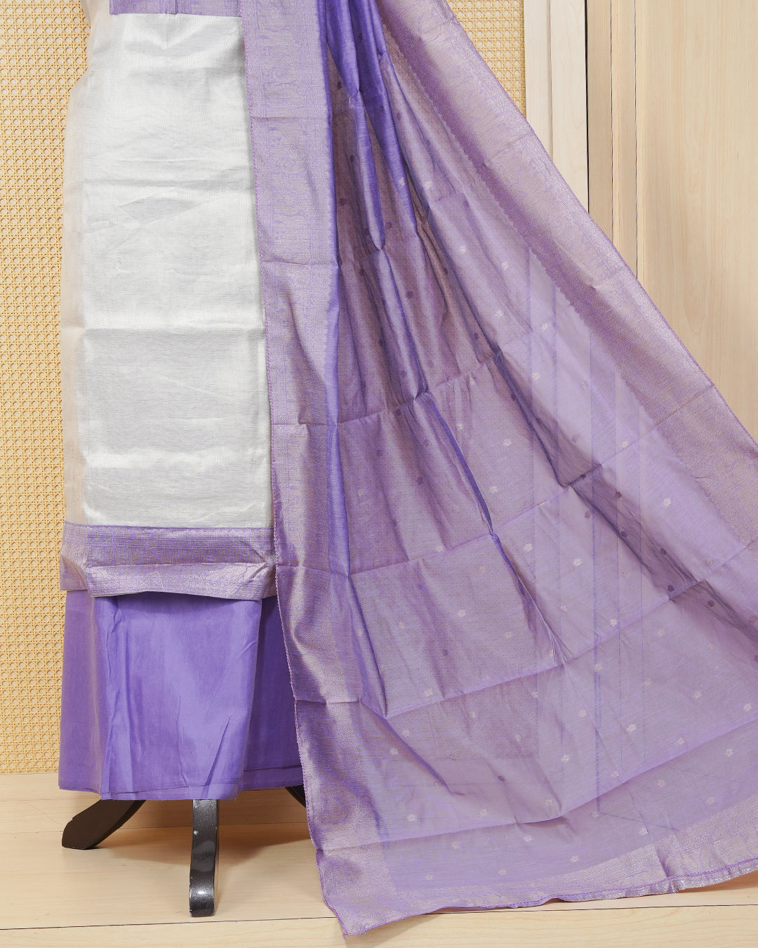 Cream colour Tissue salwar material featuring Plain Body Design without border, lavender colour work on neck portion, paired with matching bottom and elegant dupatta.