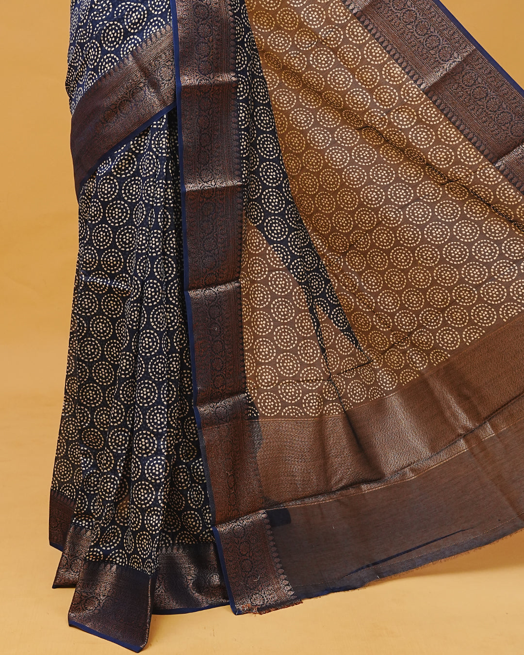 Navy Blue Colour Chanderi Silk Saree featuring dotted round motifs across the body, traditional antique zari border and paired with a matching blouse piece.
