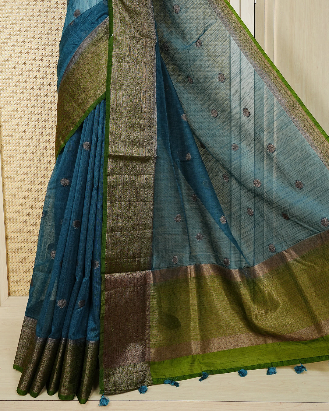 Peacock blue colour semi linen saree thread motifs on body, contrast mehndi green colour gold zari border, rich pallu comes with matching blouse piece
