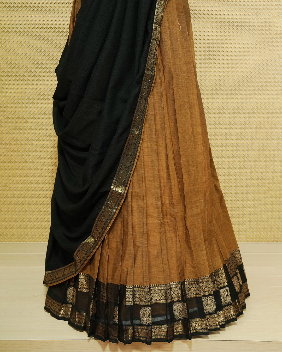Mustard Colour chettinad cotton Semi stitched dhavani set featuring Contrast Black with Gold zari border skirt, comes with Matching blouse piece & dupatta.