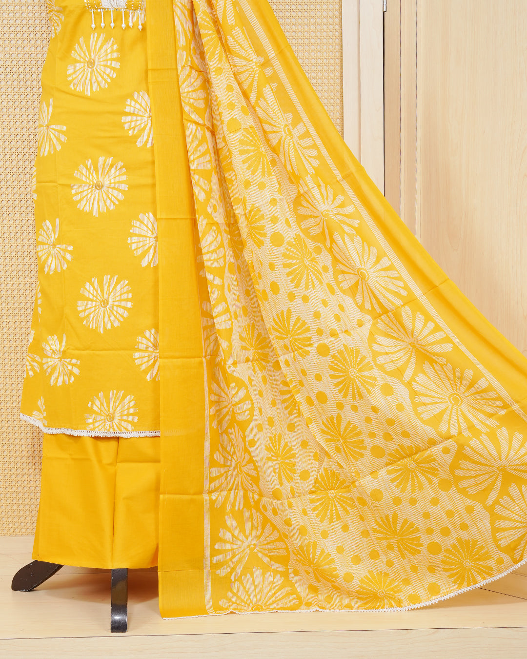 Yellow colour salwar material featuring Motifs and Beadswork on Body Design without border, paired with matching bottom and an elegant dupatta.