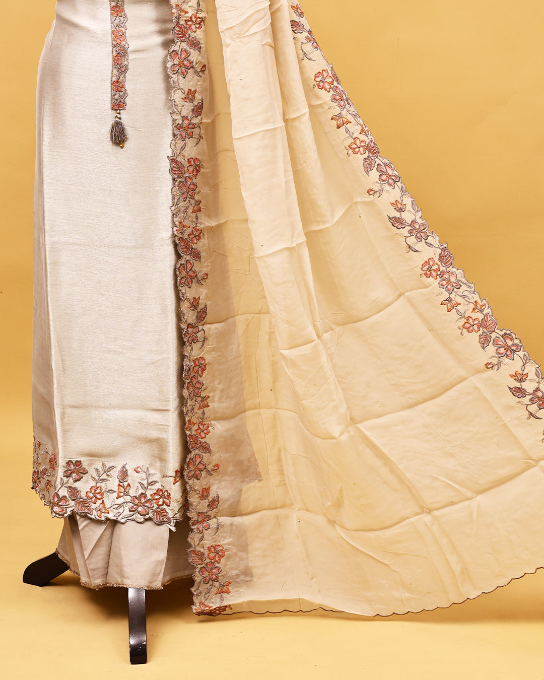 Beige colour Organza Salwar material with Thread work on body, matching bottom & Dupatta.