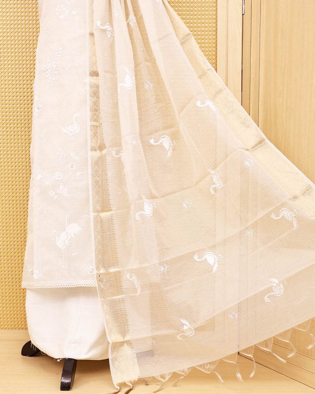 White colour Net Kota Salwar material on thread work on body, paired with matching bottom & Dupatta.