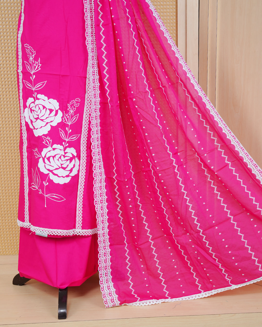 Rani pink colour Cotton Salwar Material Featuring an Threadwork on Body, lace work on neck portion, Paired With a Matching Bottom and an Elegant Dupatta.