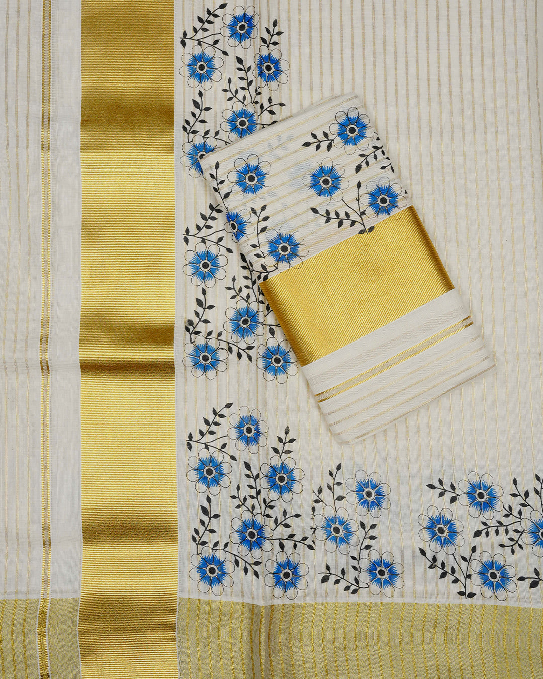 Cream colour cotton Set Mundu With Gold Zari stripes on body, enhanced with gold Kasav With Blue Floral Printed kara.