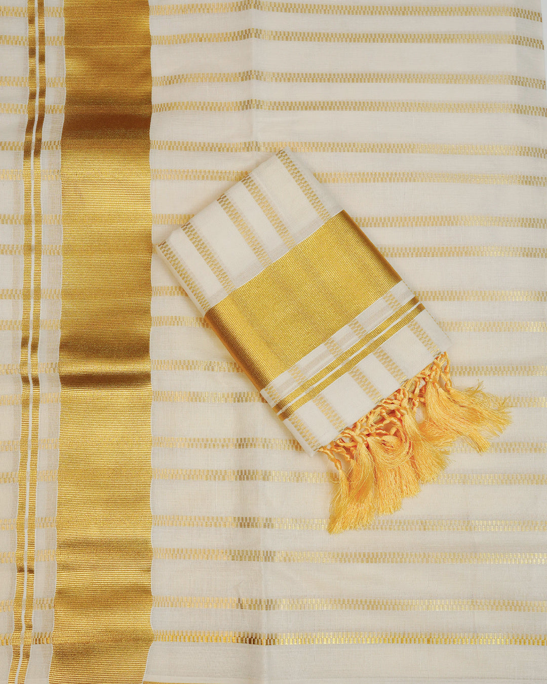 Cream colour cotton set mundu Featuring Gold zari Checks on body, complemented by classy golden with Floral print kara.