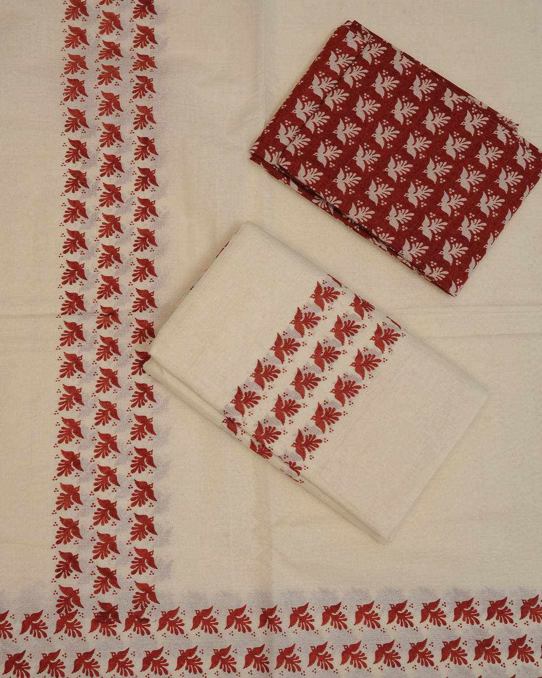 Cream colour cotton Set Mundu Features Plain body, Highlighting Brown colour bird Printed border.