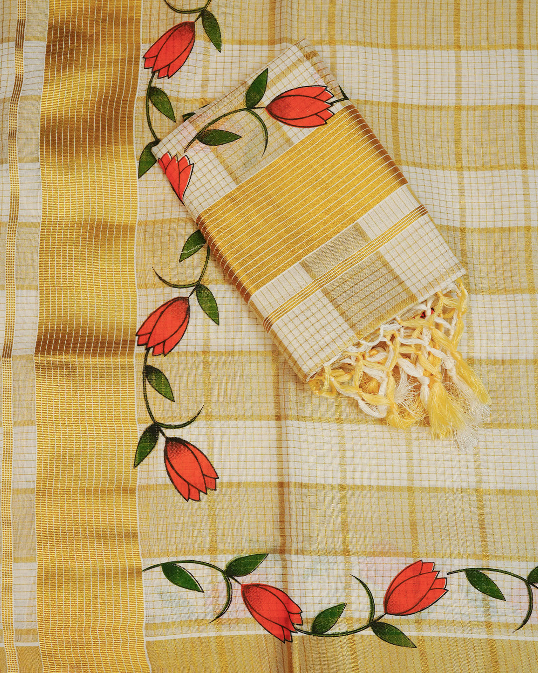 Cream colour cotton set mundu Featuring Gold zari check on body, complemented by Gold with Floral print kara.