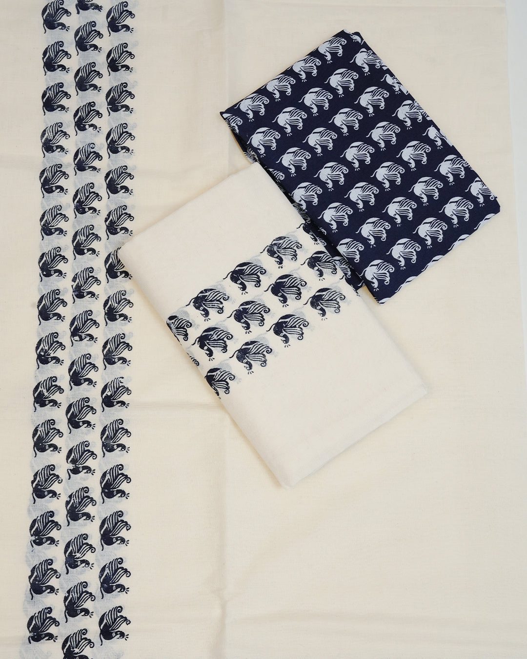 Cream colour cotton Set Mundu Features Plain body, Highlighting Blue colour Peacock Printed border.