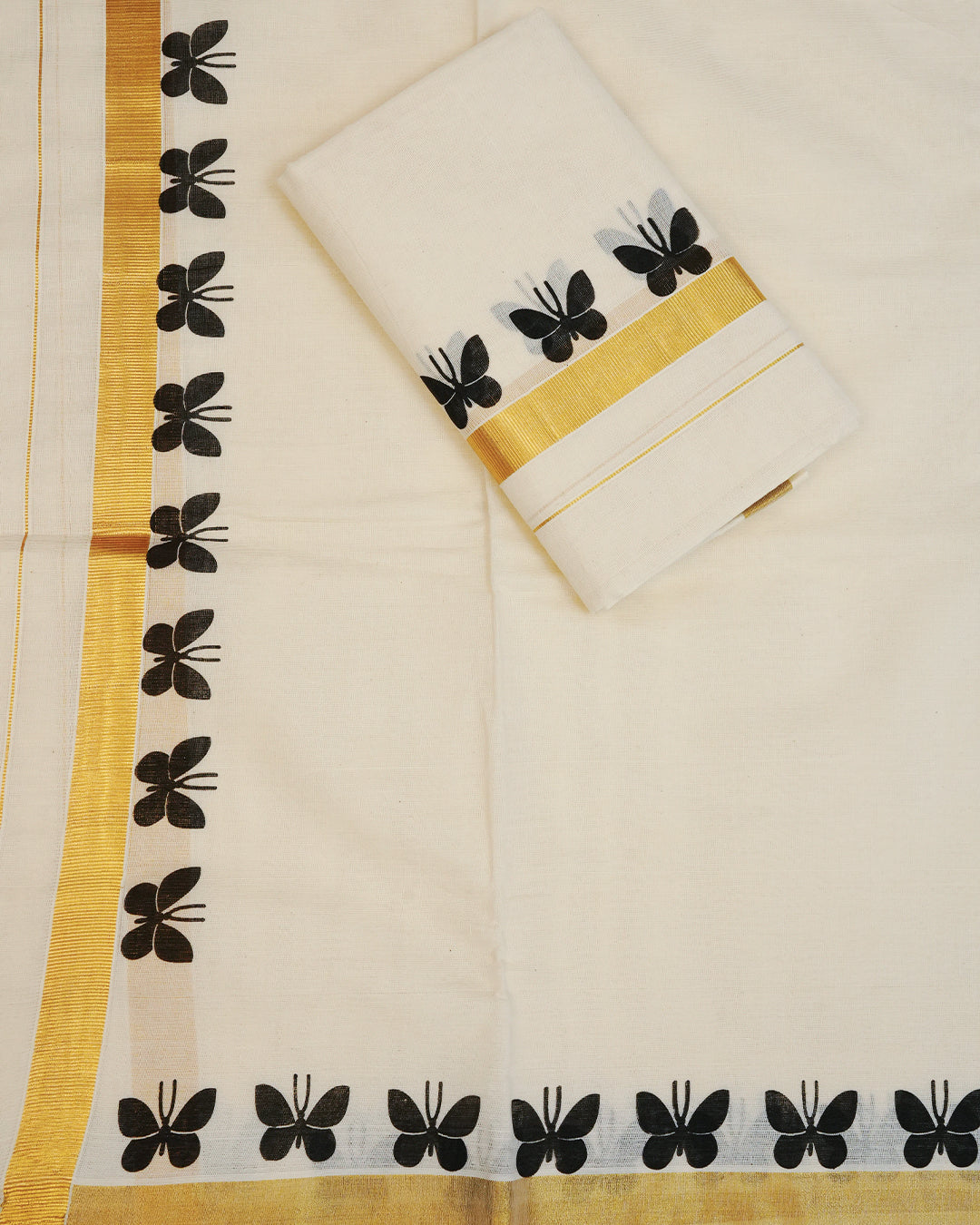 Cream colour cotton Set Mundu With Plain body, enhanced with gold Kasav With Black Butterfly Printed kara.