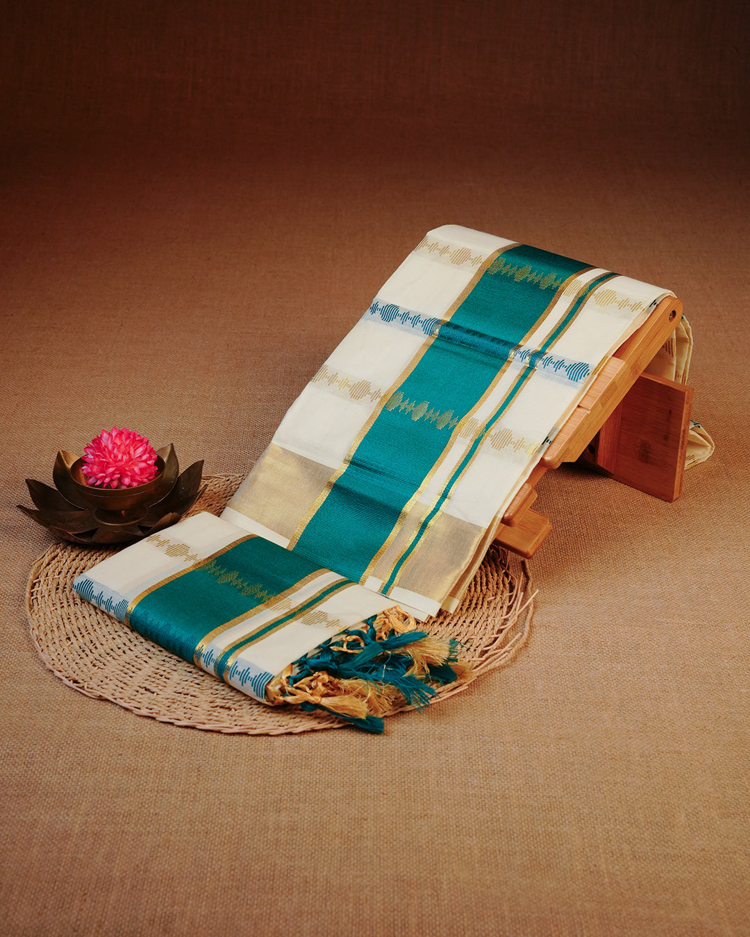 Cream colour cotton set mundu featuring Gold & Green Strips on body, featuring Classic Green & gold Kasav kara.