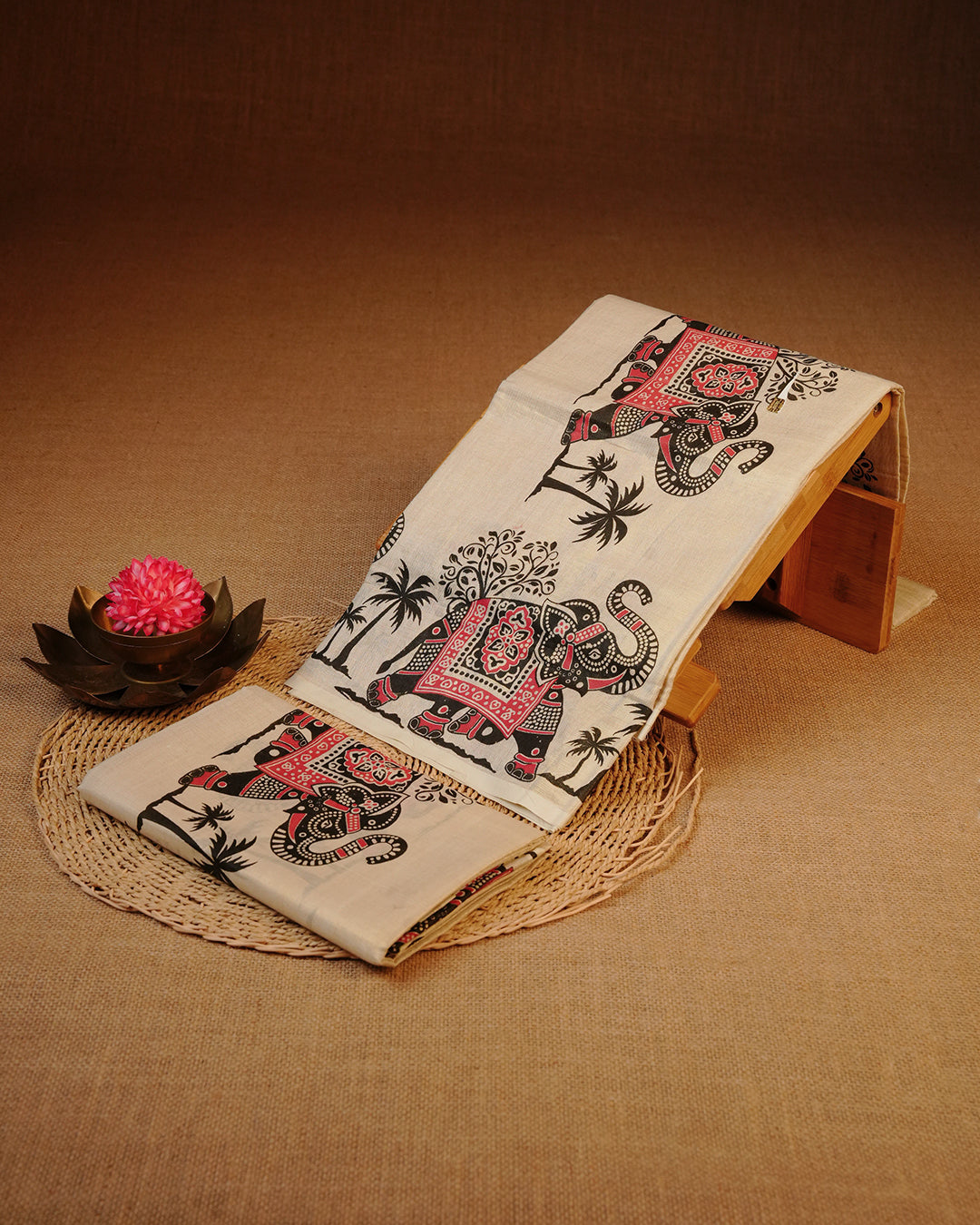 Cream colour Tissue silk set mund Featuring Elegant Gold zari Strips body, Complemented by Elephant printed border.