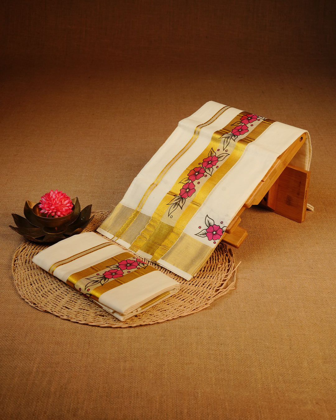 Cream colour cotton set mundu featuring plain body, complemented by Floral Print on gold zari Kara.