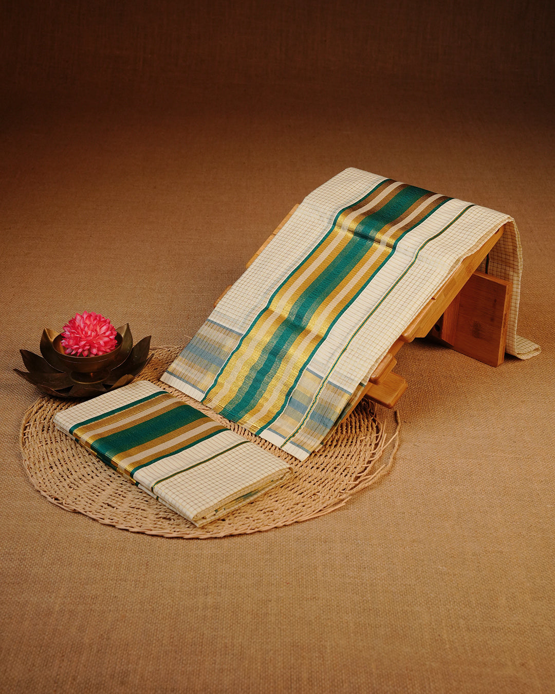 Cream colour cotton set mundu Featuring Gold zari check on body, complemented by green kara.