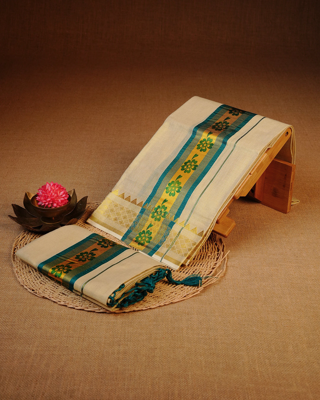 Gold Colour Tissue Set Mundu With elegant Plain body, enhanced with Teal With Gold kara.
