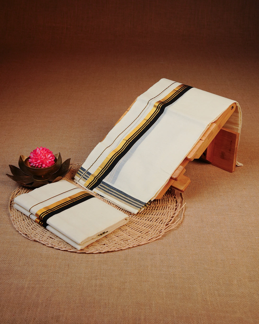 Cream colour cotton set mundu featuring Plain body with Gold & black kara.