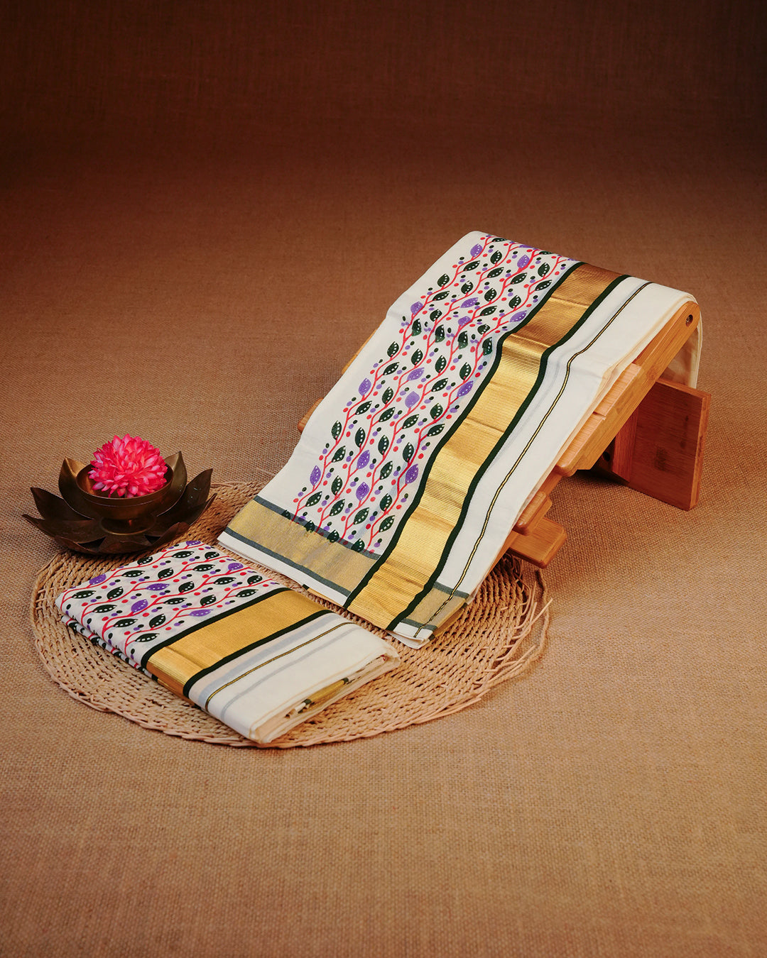 Cream colour cotton set mundu Featuring Plain, complemented by Multicolour kodi pattern With Gold & Green colour border.