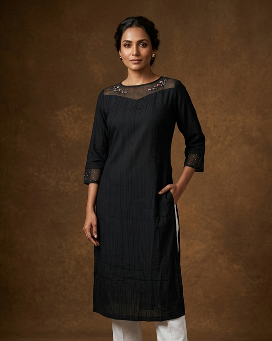 Black colour kurti featuring thread embroidery on neckline and sleeve, knee length design.