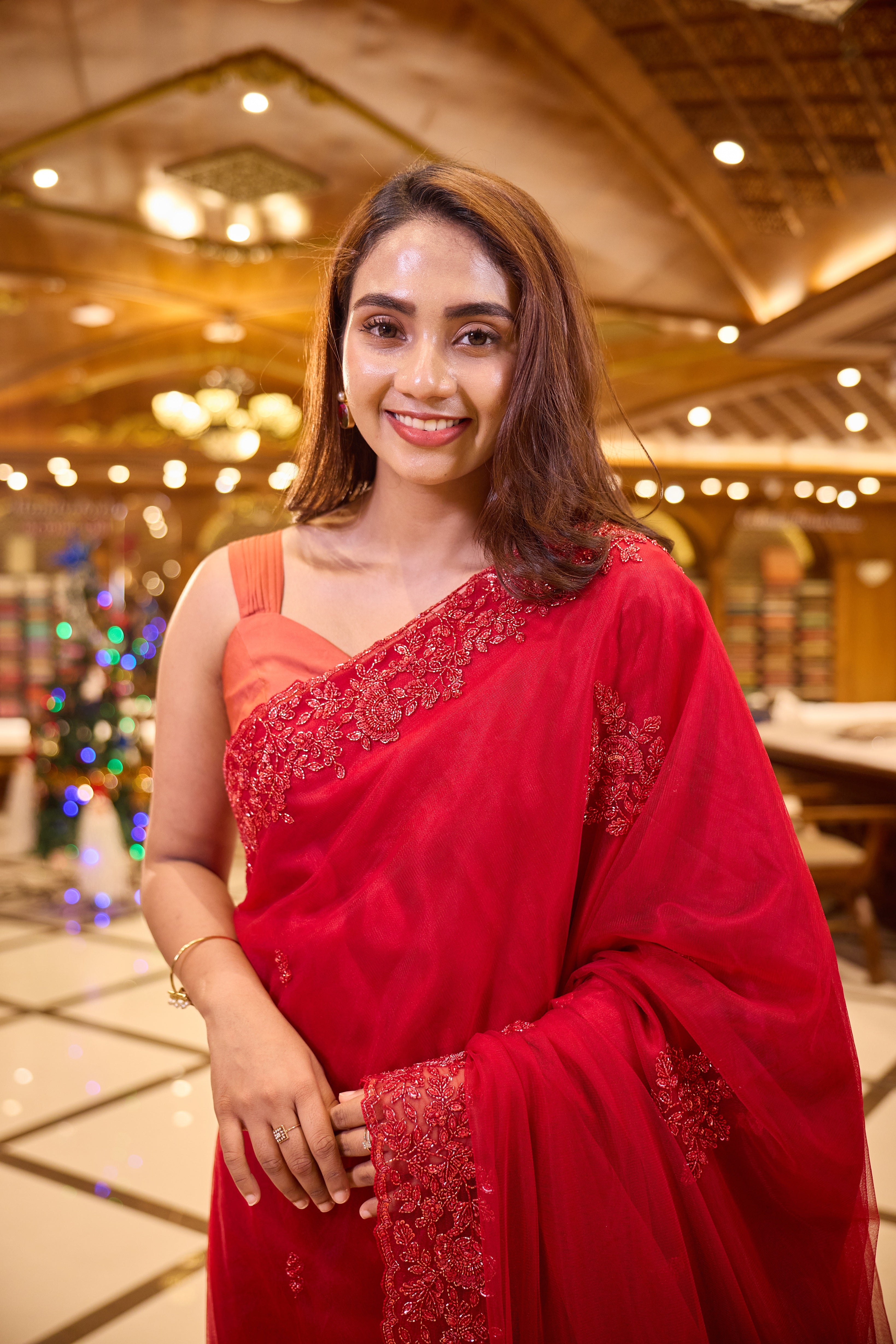 Cherry Red colour Hand dyed Premium Designer Saree, crafted in full net fabric with intricate self colour thread and bead embroidery, finished with an elegant scallop border and paired with a matching worked blouse.