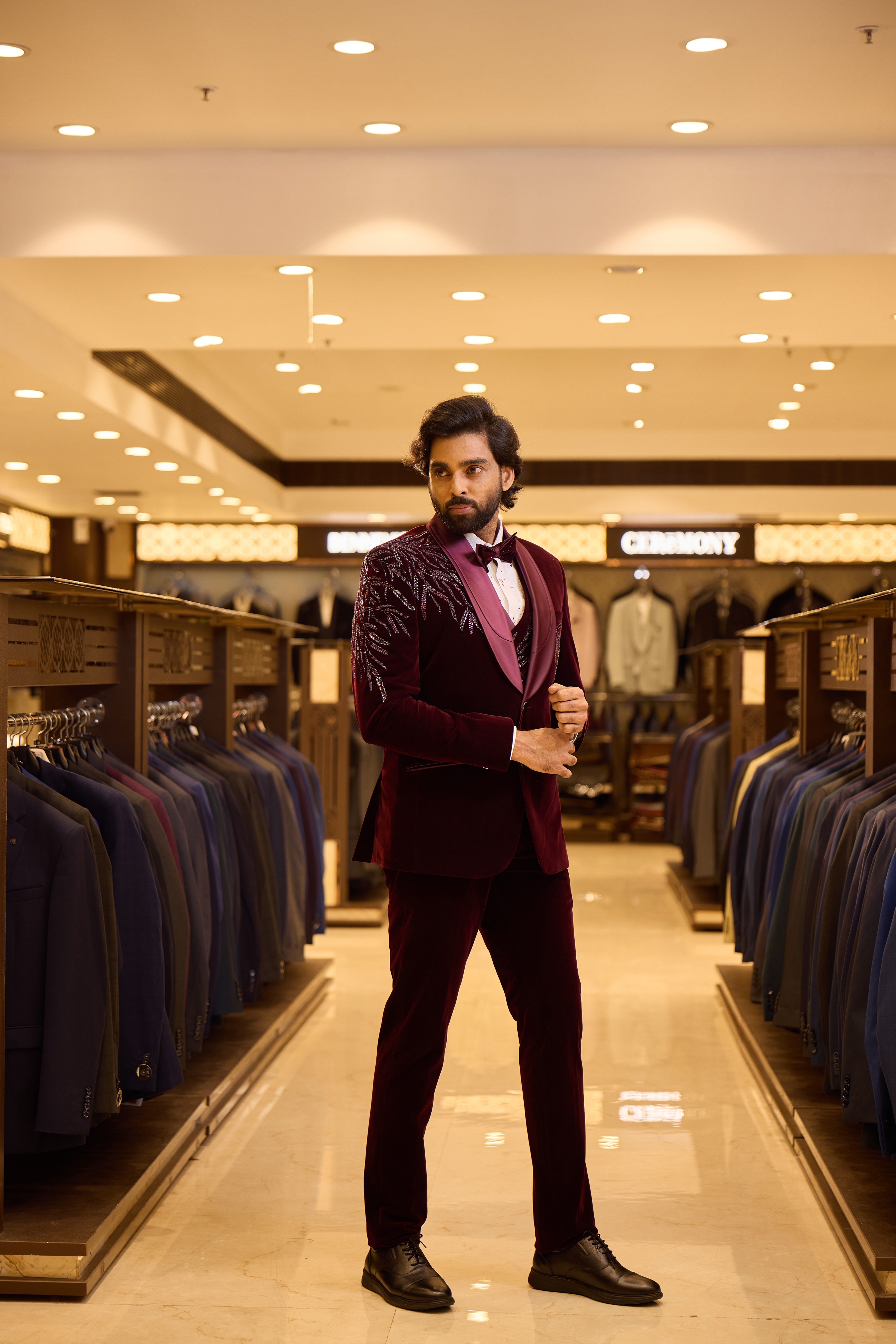 Rich maroon two tone velvet groom wear by BENNIVES, elevated with special stone work and a stylish neck d’xesto lapel for an elegant, luxurious wedding look.
