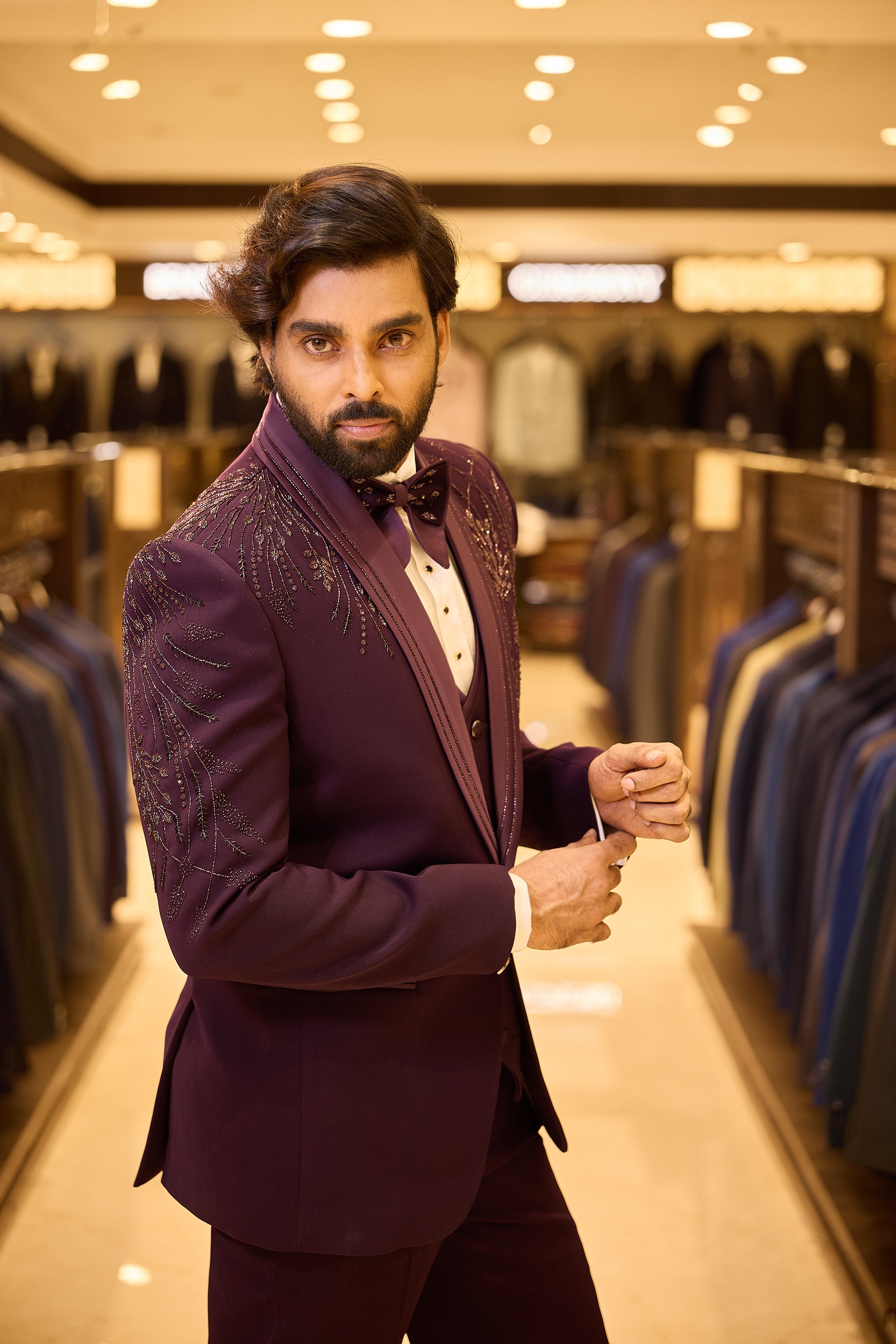 Rich purple colour 5 piece tuxedo suit crafted in premium polynosic fabric, featuring gold tone leaf beadwork all over and finished with a sleek satin lapel and single button closure for a regal groom look