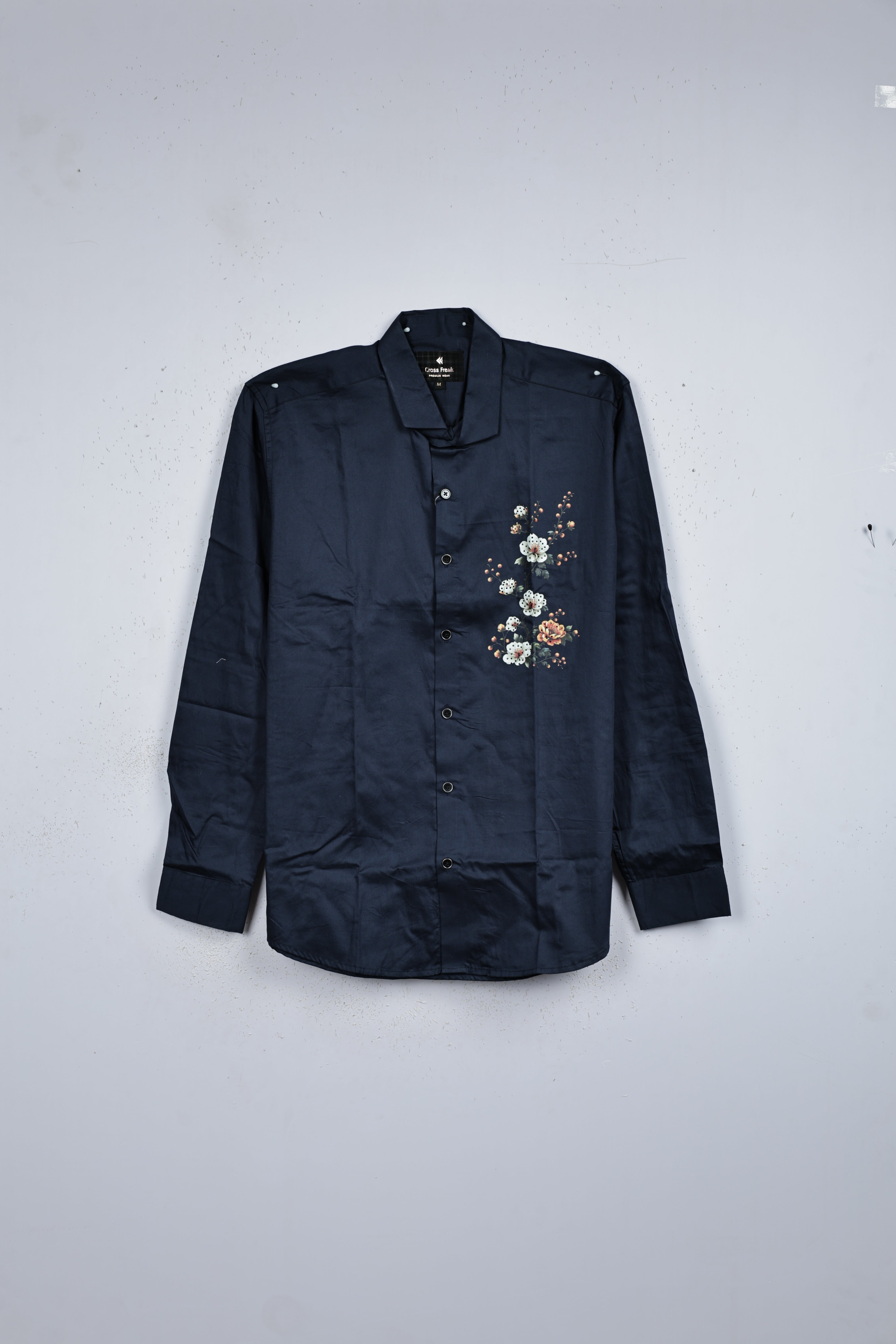 Navy blue colour shirt designed with floral print on body, classic full sleeve.